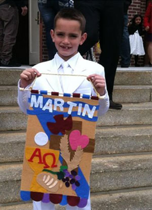 Martin Richard, de oito anos, esperava o pai na linha de chegada da maratona (Reprodução / Boston Globe)